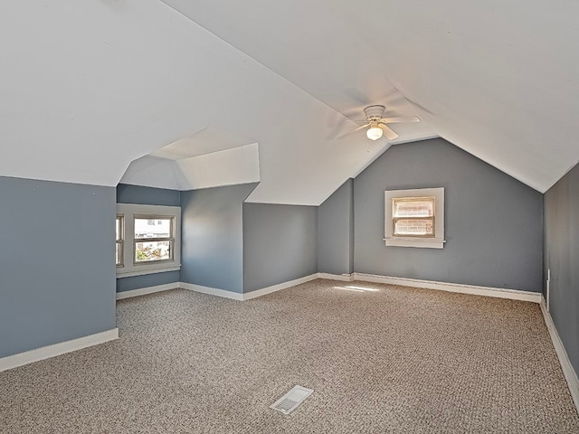 additional living space featuring lofted ceiling, ceiling fan, and carpet floors