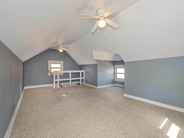 bonus room featuring lofted ceiling, ceiling fan, and carpet floors