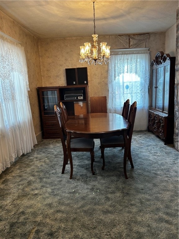 carpeted dining space with a textured ceiling and a chandelier