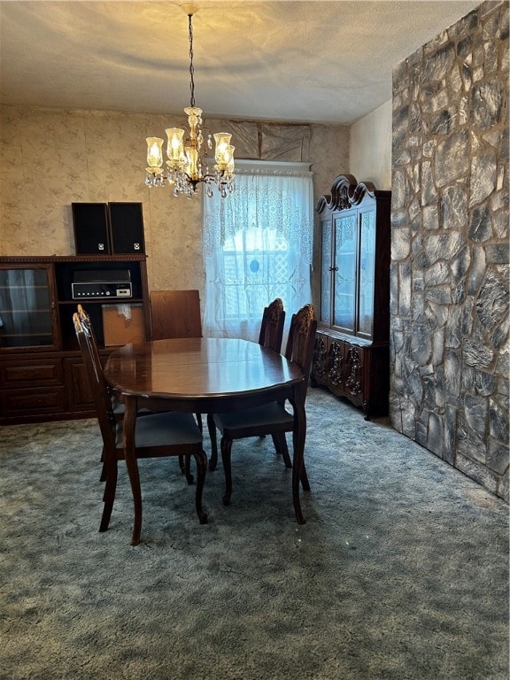 carpeted dining space with a textured ceiling and a chandelier