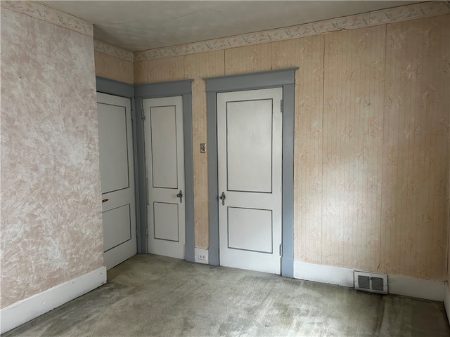 empty room featuring carpet flooring