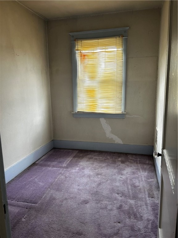 unfurnished room featuring carpet flooring