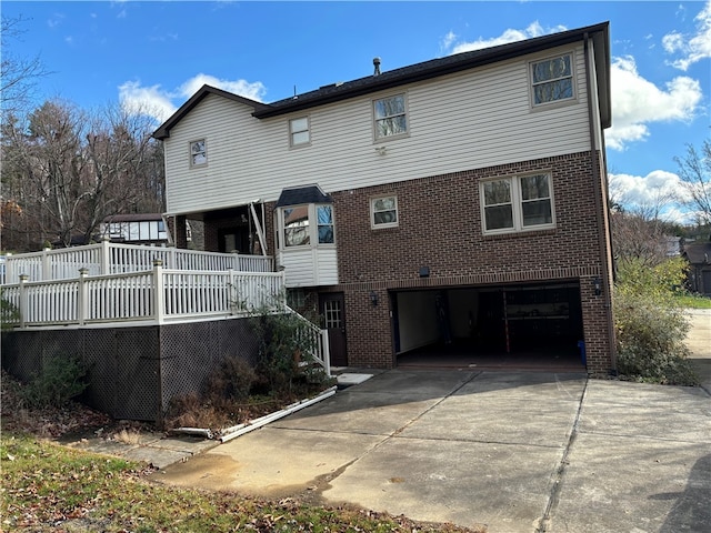 back of property with a garage