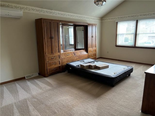 unfurnished bedroom with lofted ceiling, light colored carpet, and a wall mounted AC