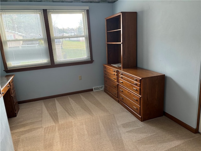 unfurnished bedroom with light carpet