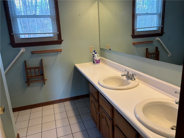 bathroom featuring vanity, a healthy amount of sunlight, and tile patterned floors