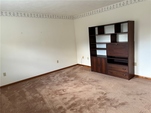 unfurnished living room featuring carpet