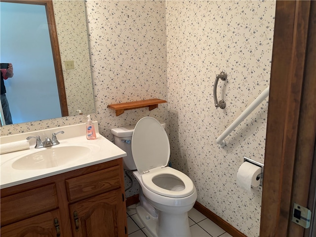 bathroom with vanity, tile patterned flooring, and toilet