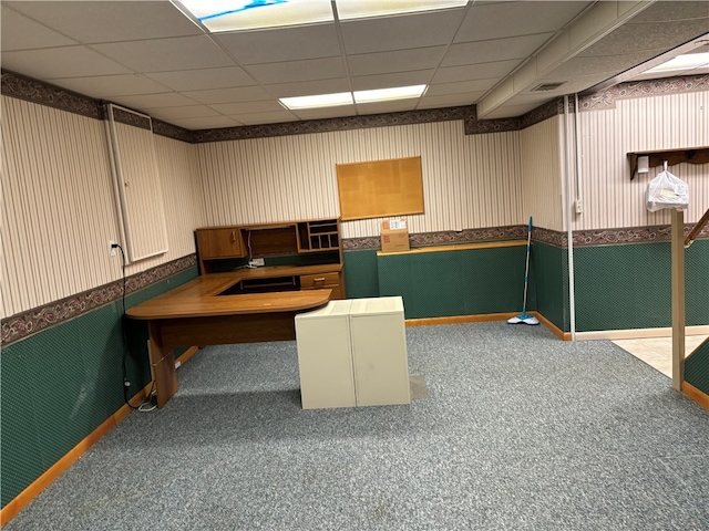 home office featuring a paneled ceiling and carpet