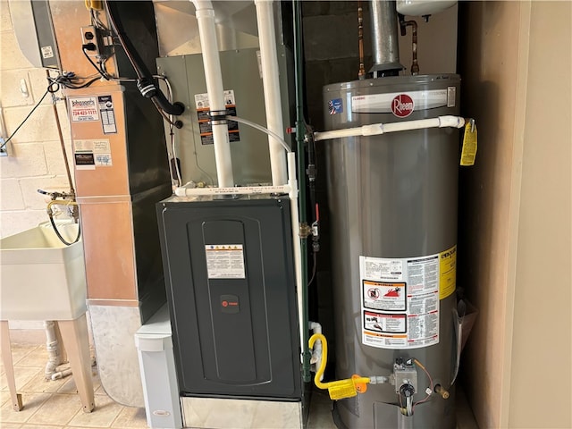 utility room featuring sink and gas water heater