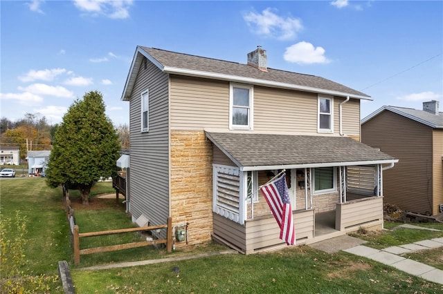 view of front of home with a front yard