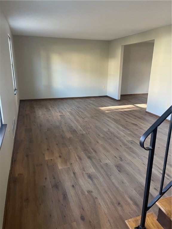 unfurnished room featuring dark hardwood / wood-style floors