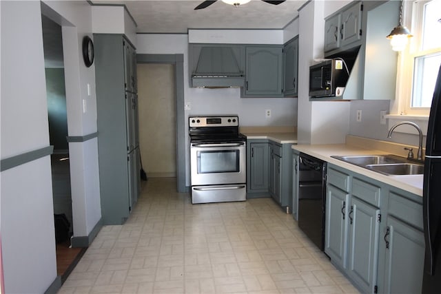 kitchen featuring custom range hood, ceiling fan, sink, black appliances, and decorative light fixtures