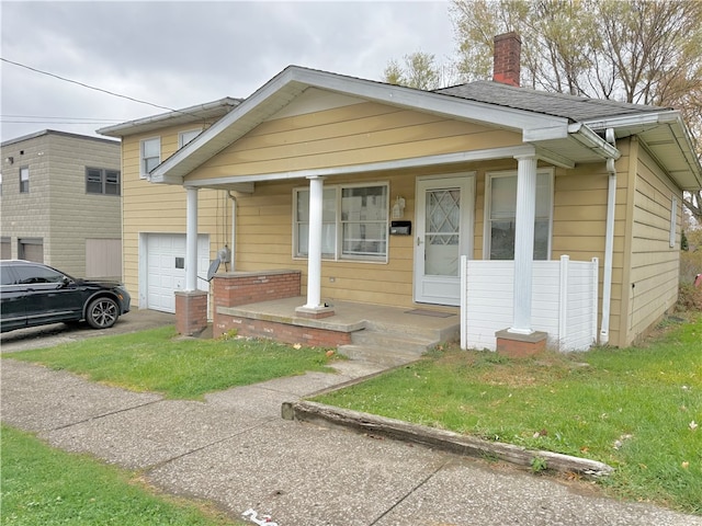 bungalow with a garage and covered porch