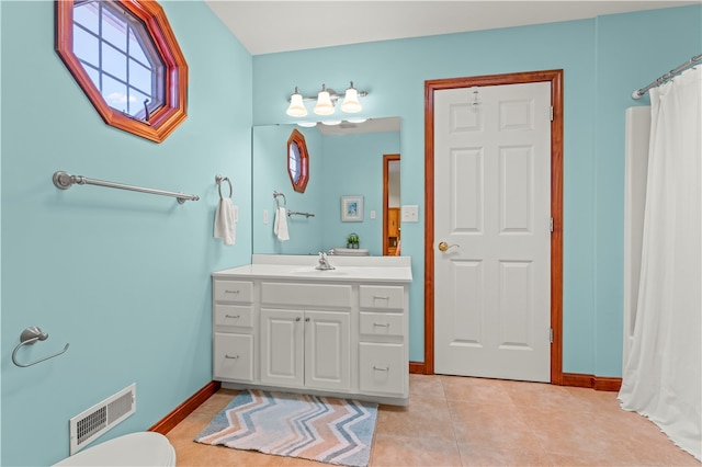 bathroom with vanity and tile patterned floors