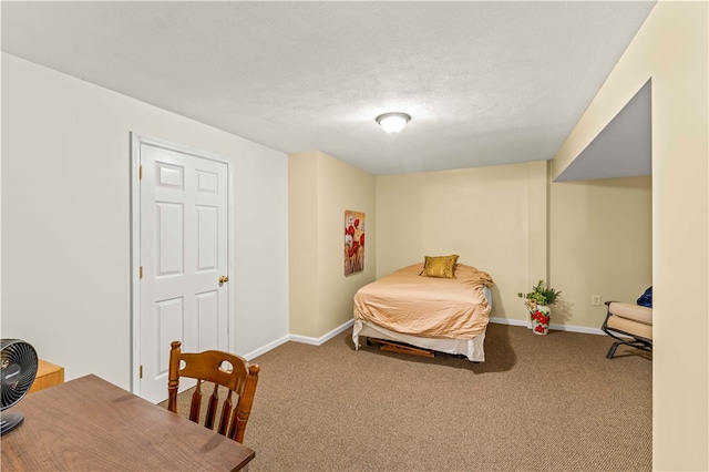 carpeted bedroom with a textured ceiling