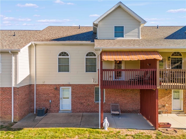 back of property with a patio and a deck