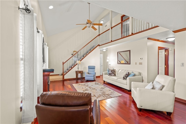 living room with high vaulted ceiling, dark hardwood / wood-style flooring, and ceiling fan