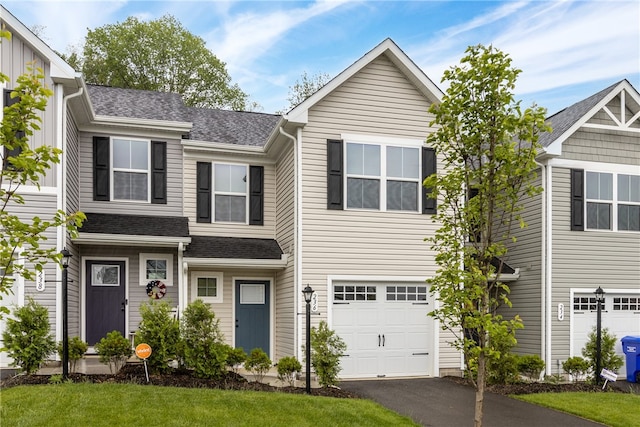 view of front of home featuring a garage and a front yard