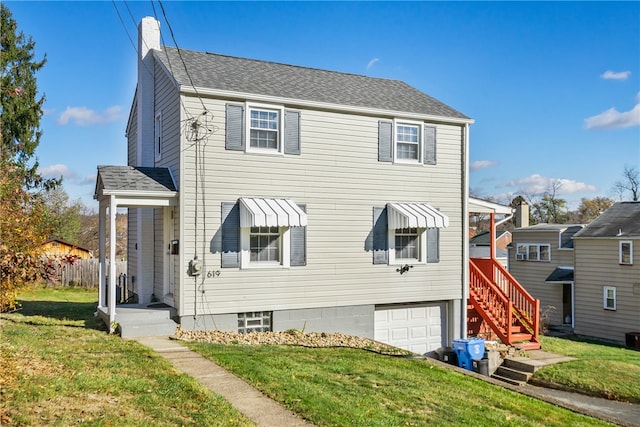 view of front facade featuring a garage and a front yard