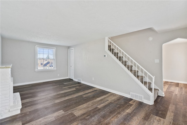 interior space with hardwood / wood-style floors and a textured ceiling