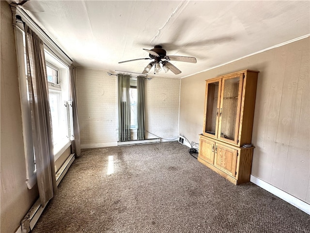 unfurnished room featuring ceiling fan, a baseboard radiator, and crown molding