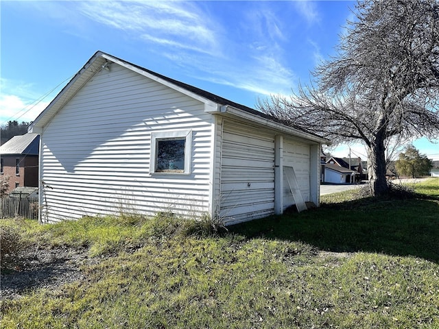 garage featuring a yard