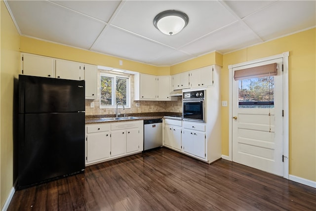 kitchen with dark wood-type flooring, a healthy amount of sunlight, black appliances, and white cabinetry