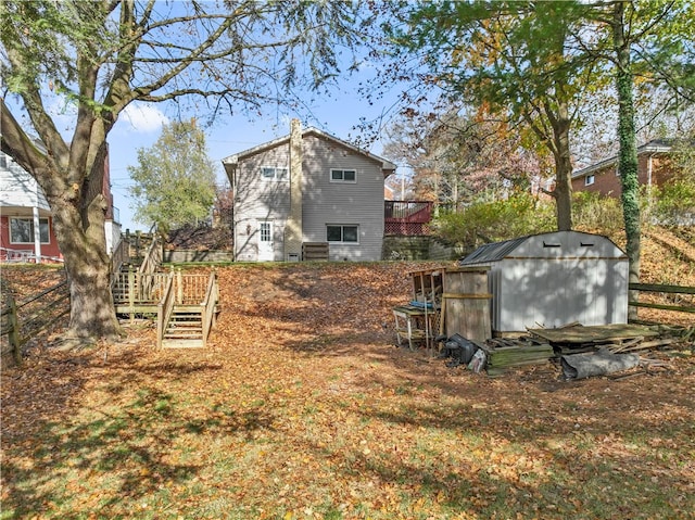 view of yard featuring a shed and a wooden deck