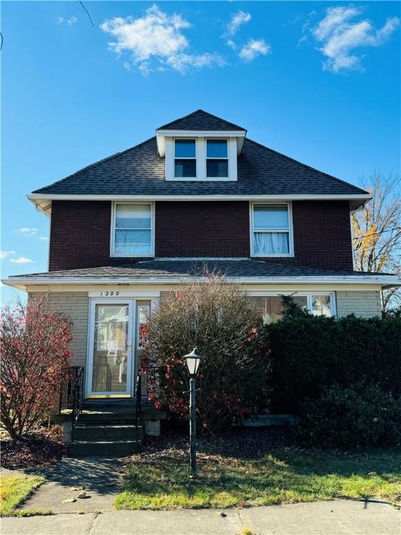 1300 Sycamore St, Connellsville, PA 15425 - traditional style home with brick siding and a shingled roof
