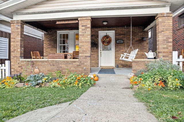 doorway to property featuring a porch