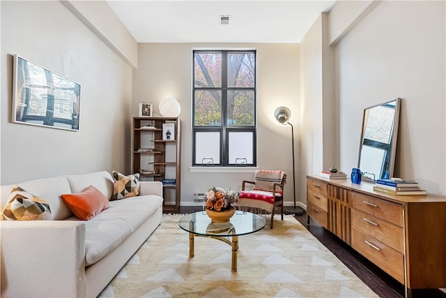 sitting room with hardwood / wood-style flooring