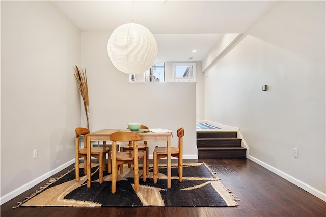 dining area featuring dark hardwood / wood-style floors