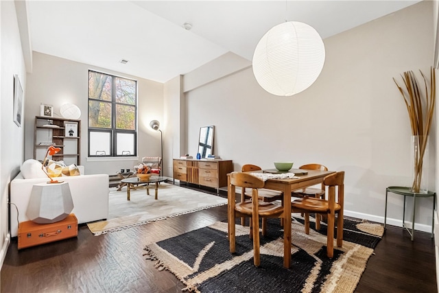 dining space featuring dark hardwood / wood-style flooring