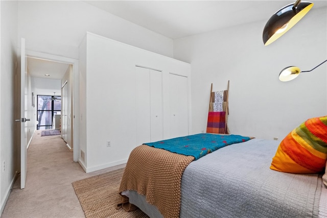 carpeted bedroom with a closet