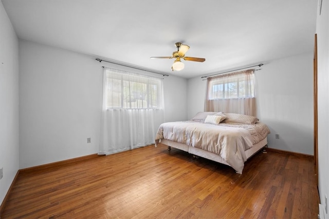 bedroom featuring hardwood / wood-style floors and ceiling fan