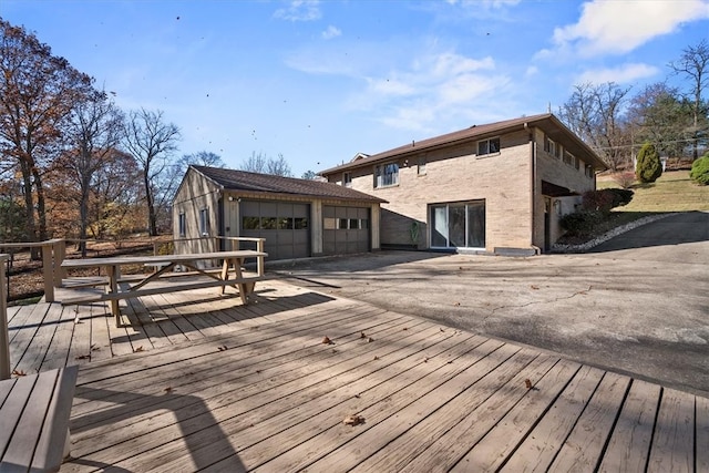 wooden deck with a garage