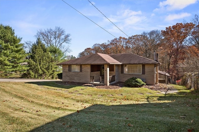 ranch-style home featuring a front yard