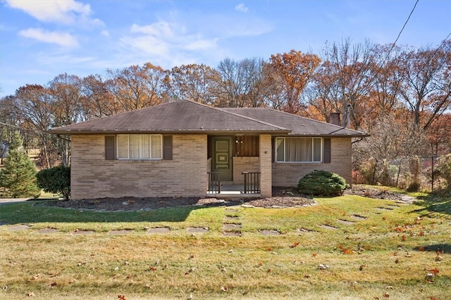 ranch-style home featuring a front yard