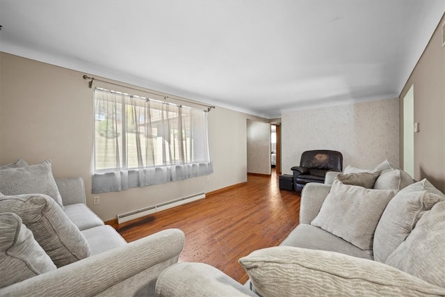 living room featuring hardwood / wood-style flooring and a baseboard heating unit