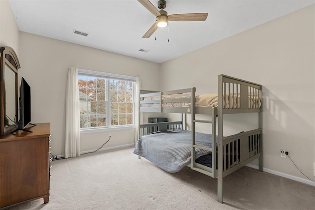 bedroom with light carpet and ceiling fan