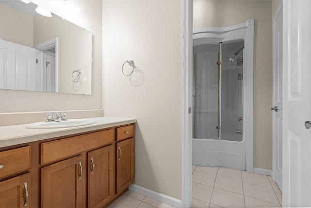 bathroom with shower / bath combination with glass door, tile patterned floors, and vanity