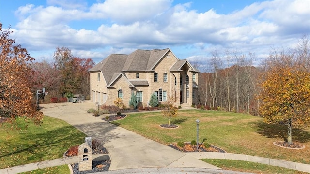 view of front of house with a front lawn and a garage