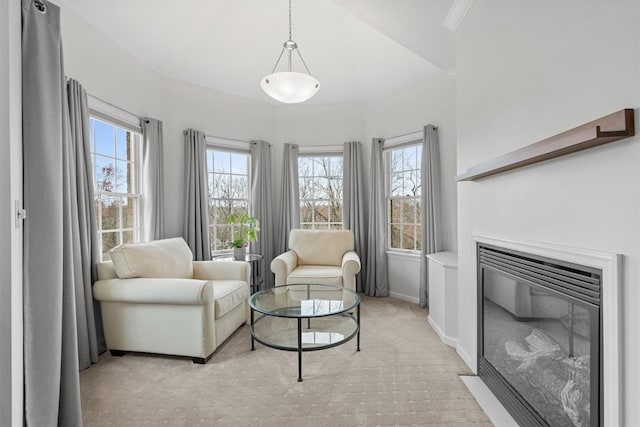 living area with light colored carpet and plenty of natural light