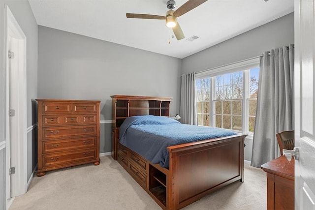 bedroom featuring ceiling fan and light carpet