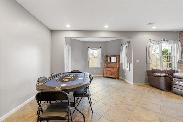 dining space with a healthy amount of sunlight and light tile patterned flooring