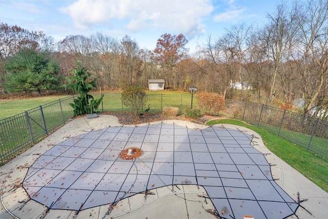 view of pool featuring a lawn and a patio area