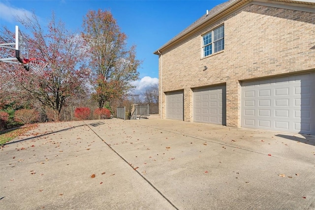 view of side of home with a garage