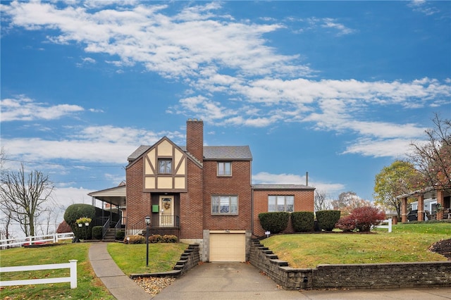 view of front of property featuring a front yard, a garage, and covered porch