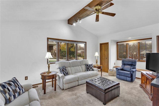 carpeted living room featuring vaulted ceiling with beams and ceiling fan